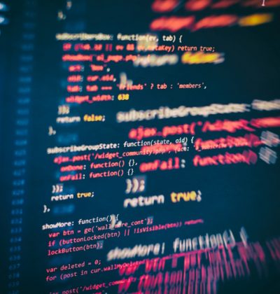 Website HTML Code on the Laptop Display Closeup Photo. Desktop PC monitor photo.