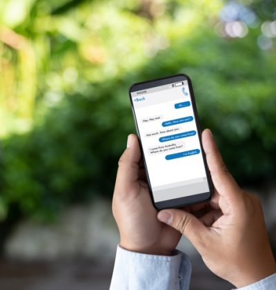man touch on button instant messaging app on mobile phone